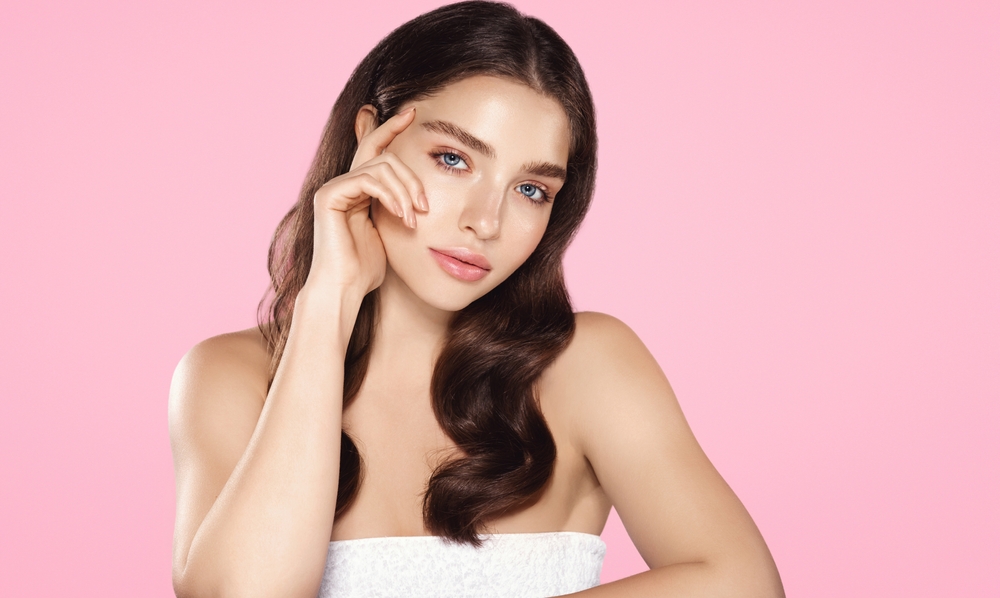 woman showing off results from complexion correction in Capitol Hill