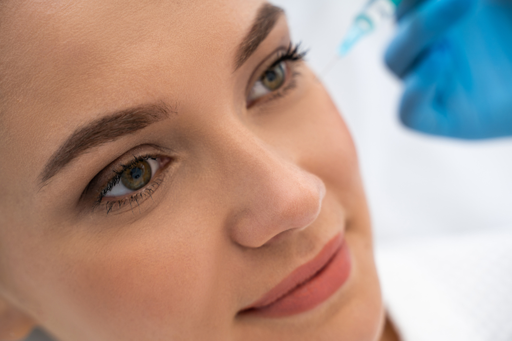 woman getting PDGF for under eyes in Capitol Hill