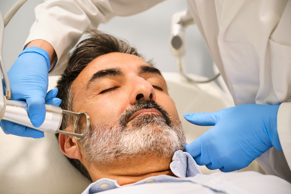 man getting a laser treatment in Capitol Hill