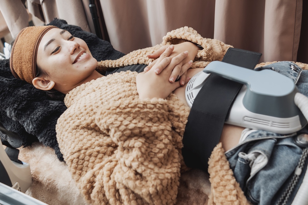 woman getting Emsculpt in Capitol Hill